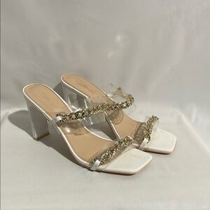 Elegant Clear Heeled Sandals with Gold Accents